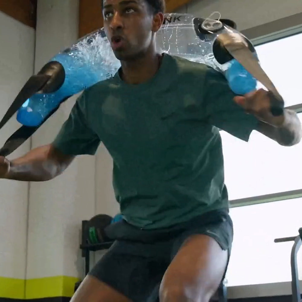 Mid-session with a water-filled tube during a guided workout